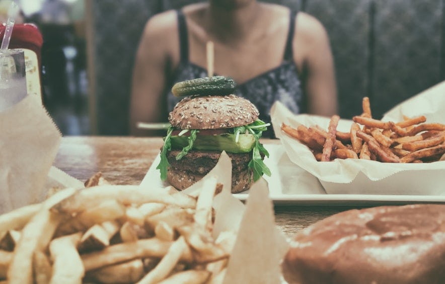 picture of woman with an eating disorder looking at food
